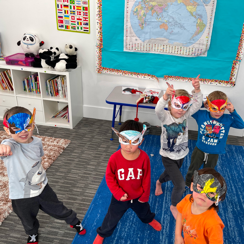 Group of preschool age children with their super hero masks